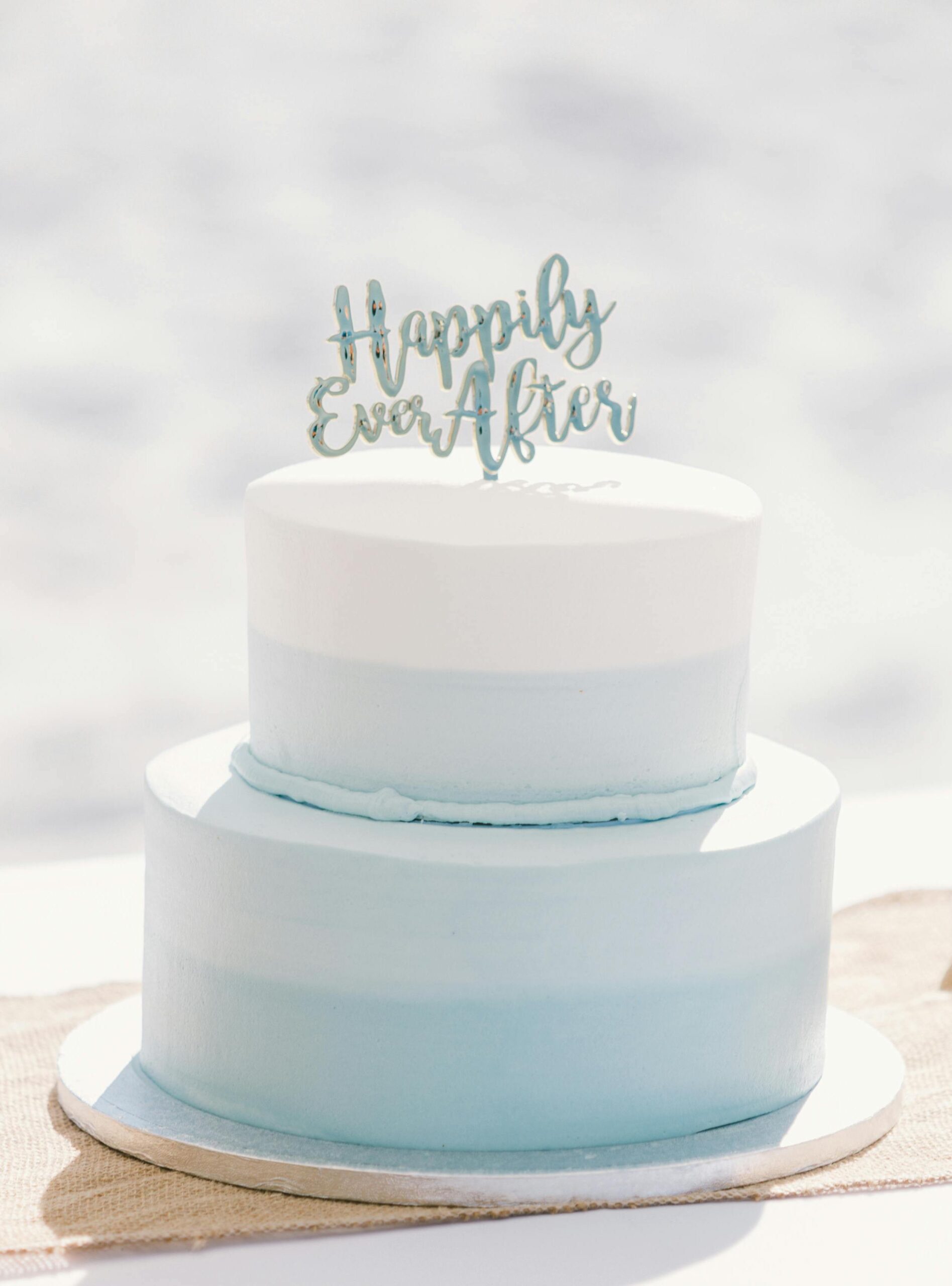 ### 9. Pale Blue Ombre Cake & Gold Topper