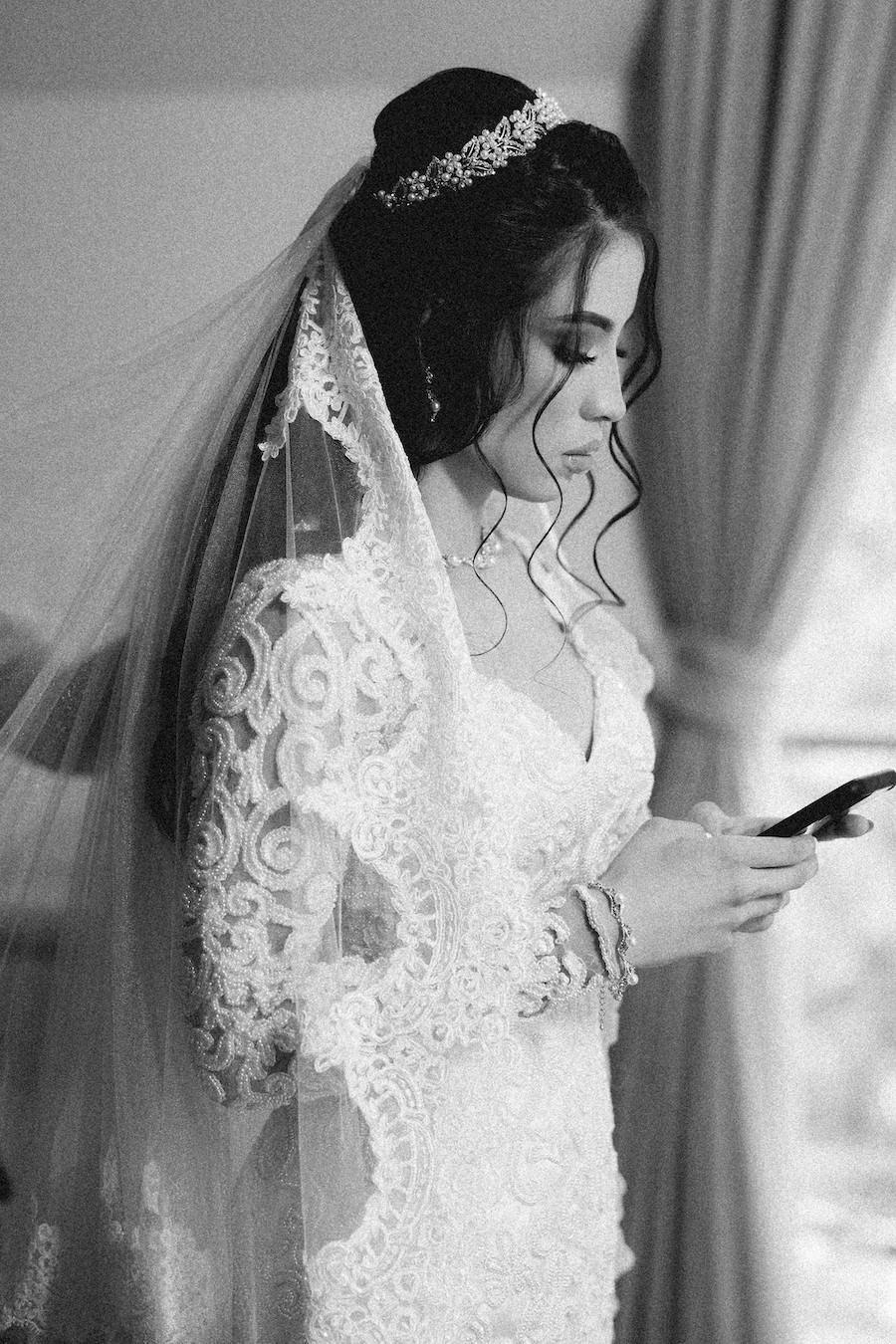 ### 14. Beaded Tiara Updo and Lace Veil