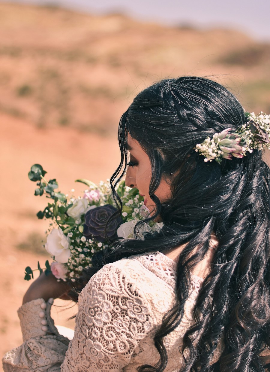 ### 16. Boho Half-Up Curls With Floral Crown