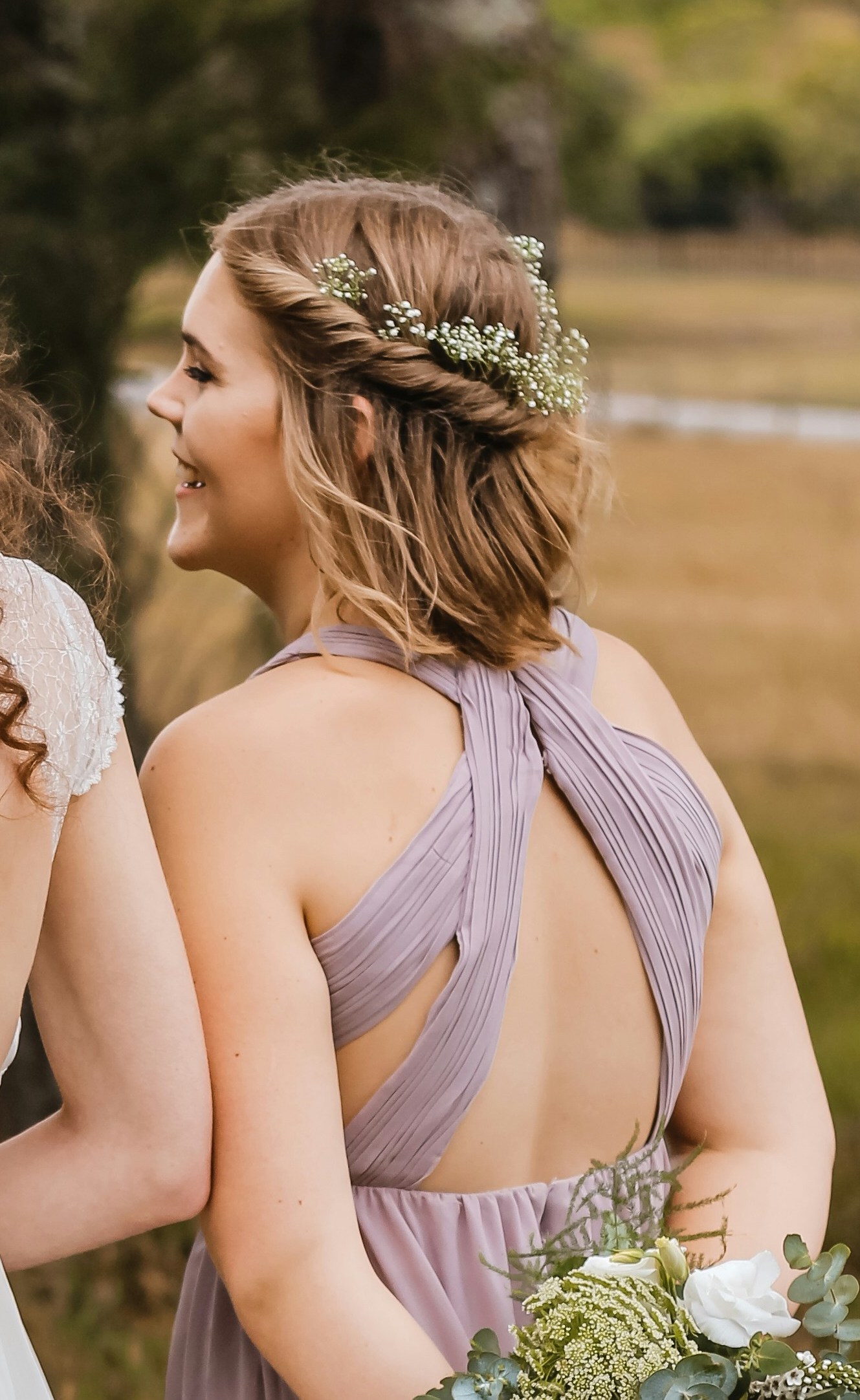 ### 16. Short Wavy Half-Up Hair With Baby’s Breath
