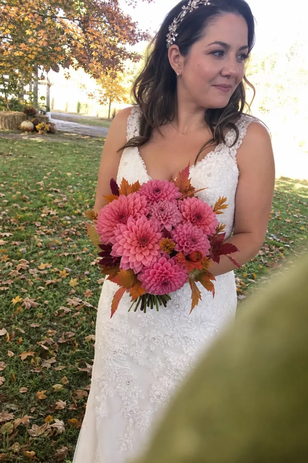 Bride holding a pink dahlia bouquet, a rich fall take on pink wedding bouquets